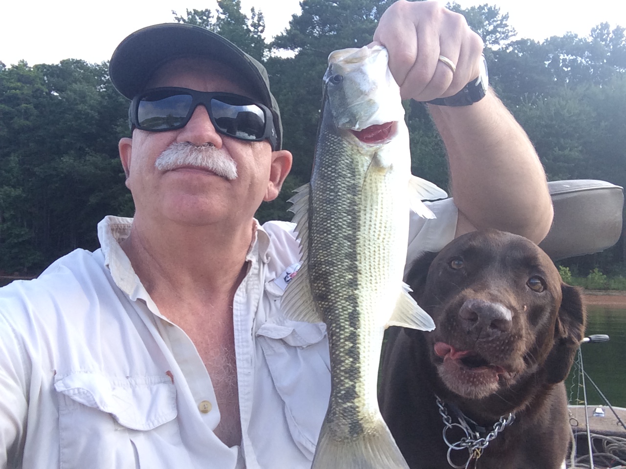 Photo of Dale and his dog, Mocha, fishing