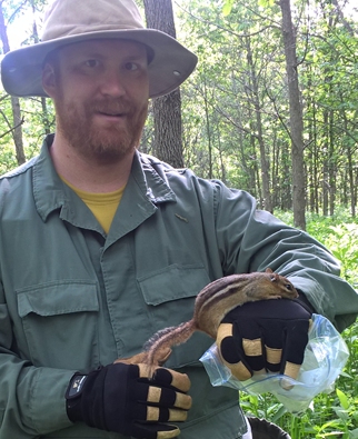 Dr. Green holding a chipmunk